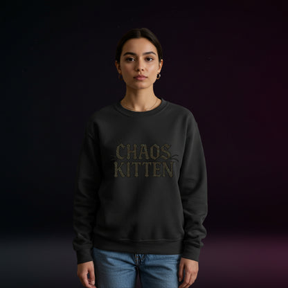 Person wearing a black sweatshirt with 'CHAOS KITTEN' text on a dark background