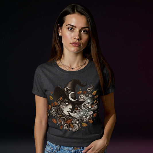 Woman wearing a dark t-shirt with a graphic design against a dark background